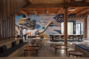 Open commons area at The Shop New Orleans coworking space with shared work areas and modern design