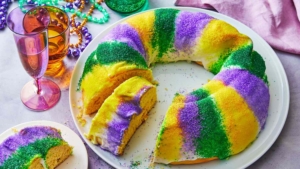 Picture of King Cake with one piece missing.