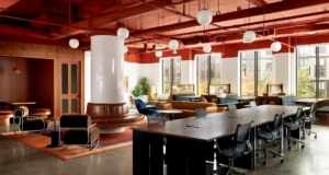 Open common area at The Shop BK coworking space in Brooklyn, New York with lounge seating and shared work areas