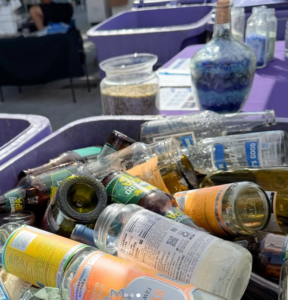 glass bottles in a glass recycling bin