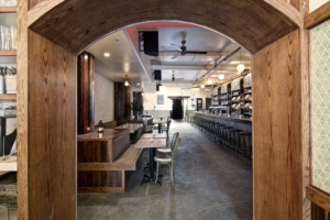 Threes Brewing backyard beer garden with outdoor seating and greenery in Gowanus, Brooklyn